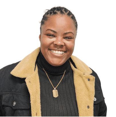 Smiling person with short hair and jacket.